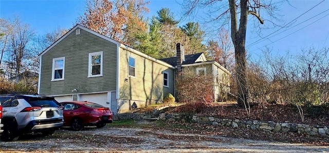 view of property exterior featuring a garage