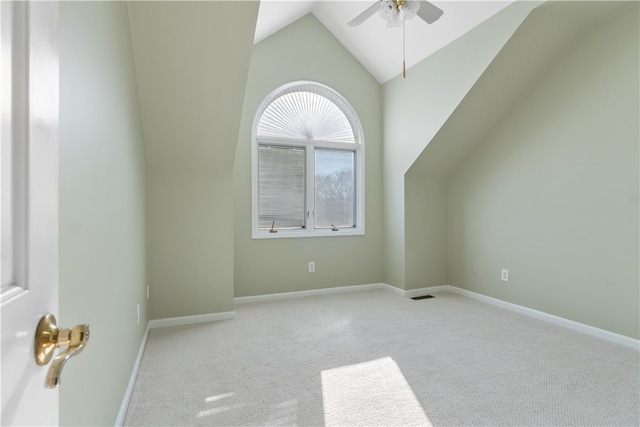 bonus room featuring ceiling fan, lofted ceiling, and light carpet