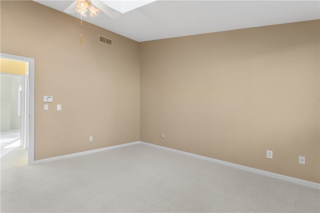 carpeted spare room with ceiling fan