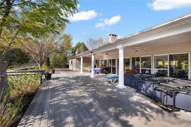 wooden deck with ceiling fan