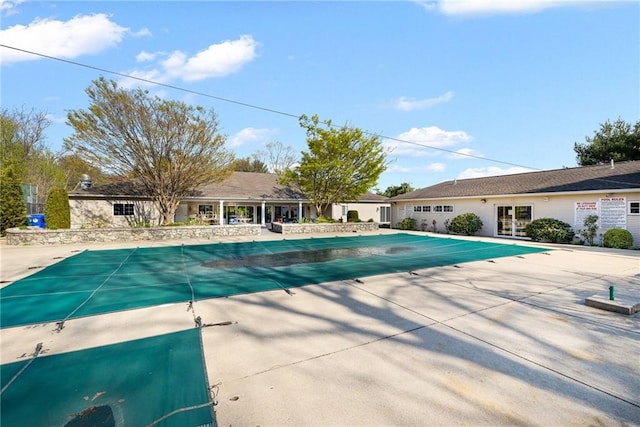 view of swimming pool featuring a patio