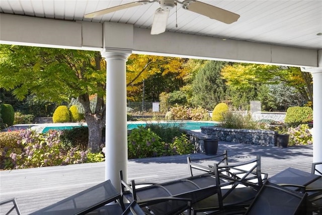 exterior space featuring ceiling fan and a pool side deck