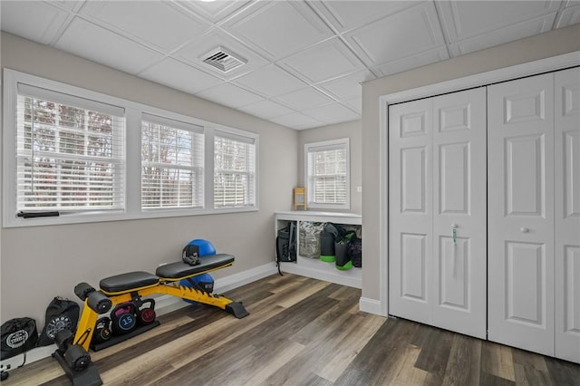 exercise area with dark hardwood / wood-style floors