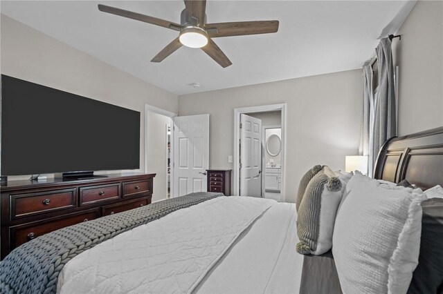 bedroom featuring ensuite bathroom and ceiling fan