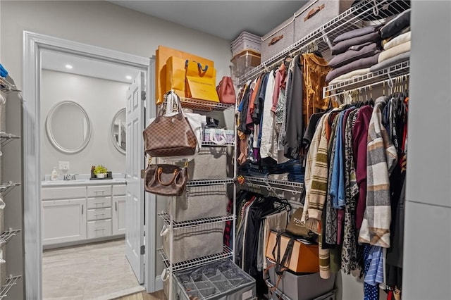 spacious closet featuring sink