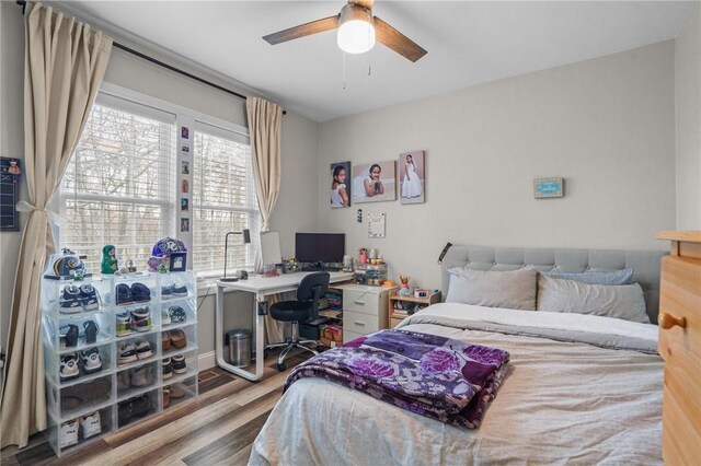 bedroom featuring ceiling fan and light hardwood / wood-style flooring