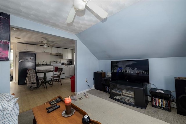 living room with ceiling fan, sink, light colored carpet, and lofted ceiling