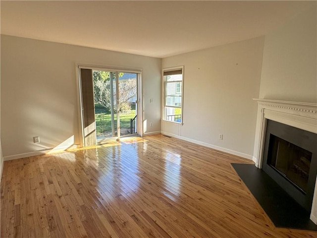 unfurnished living room with light hardwood / wood-style floors