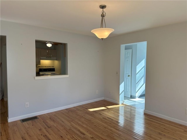 unfurnished room featuring light hardwood / wood-style floors