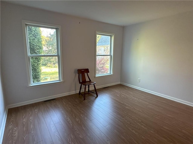 spare room with hardwood / wood-style flooring