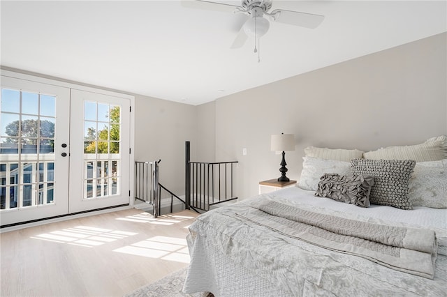 bedroom featuring access to outside, ceiling fan, french doors, and light hardwood / wood-style floors