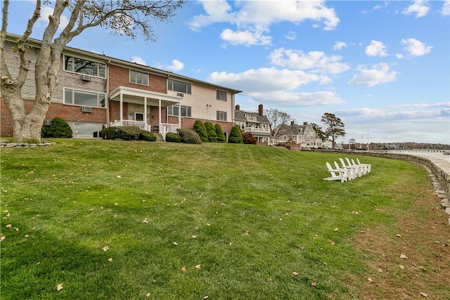 view of home's community with a lawn