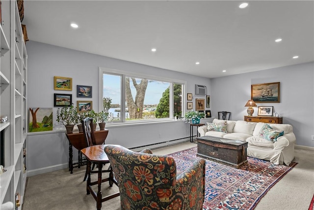 living room featuring light carpet, baseboard heating, and a wall unit AC