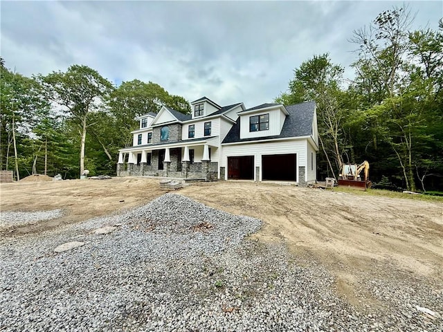 12 Beechwood Dr, Cranston, RI 02921 - view of front of house with driveway, an attached garage, and a porch