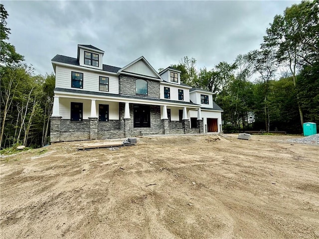 12 Beechwood Dr, Cranston, RI 02921 - view of front facade with stone siding and covered porch