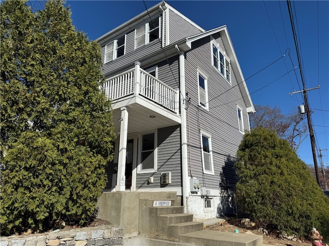 view of front of home with a balcony