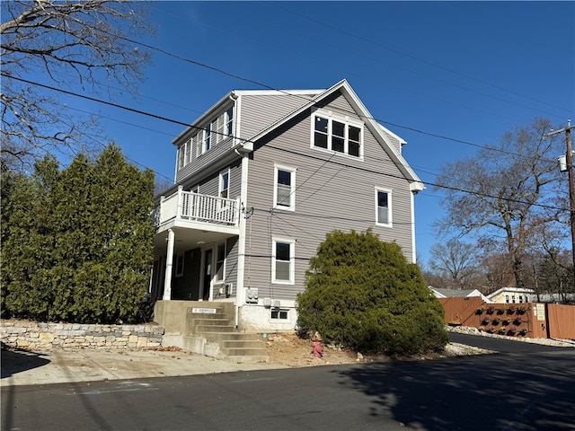 view of home's exterior with a balcony