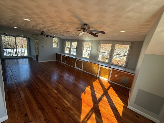 interior space featuring dark hardwood / wood-style flooring and a textured ceiling