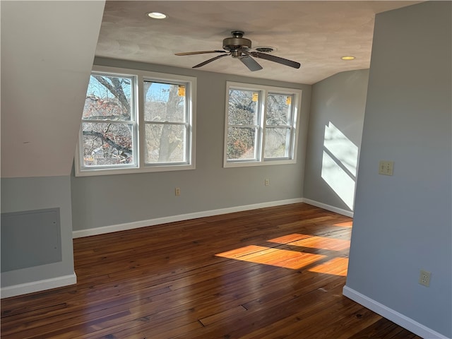 empty room featuring ceiling fan and dark wood-type flooring