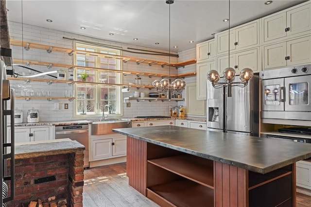 43 Old Beach Rd, Newport, RI 02840 - kitchen featuring open shelves, a sink, stainless steel appliances, and recessed lighting