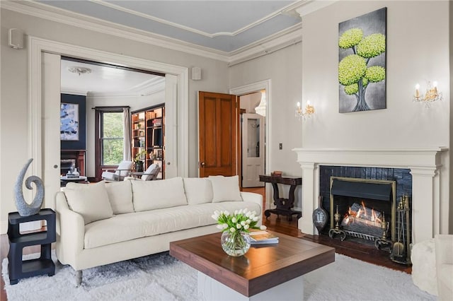 43 Old Beach Rd, Newport, RI 02840 - living room featuring a fireplace with flush hearth, ornamental molding, and wood finished floors