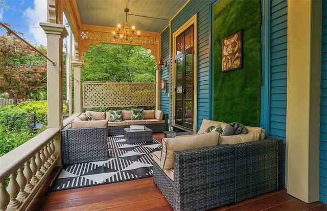 sunroom featuring plenty of natural light, wooden ceiling, and a notable chandelier