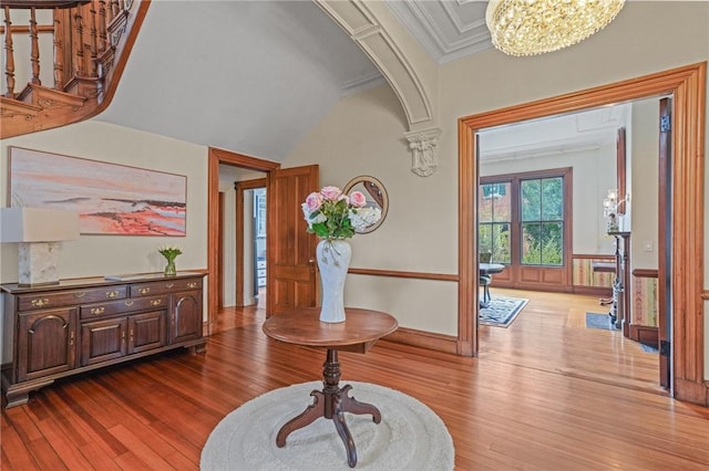 43 Old Beach Rd, Newport, RI 02840 - foyer entrance with hardwood / wood-style floors, a chandelier, crown molding, and baseboards