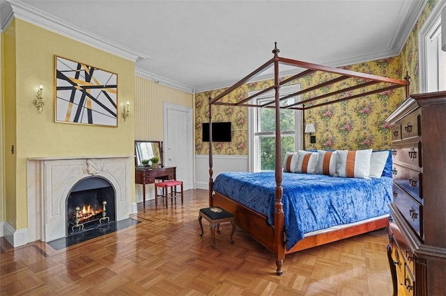 bedroom featuring parquet floors, crown molding, and a premium fireplace