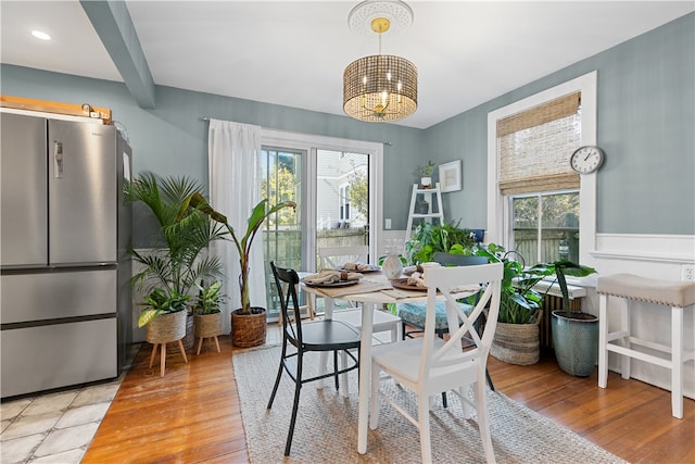 dining room with light hardwood / wood-style floors and a wealth of natural light