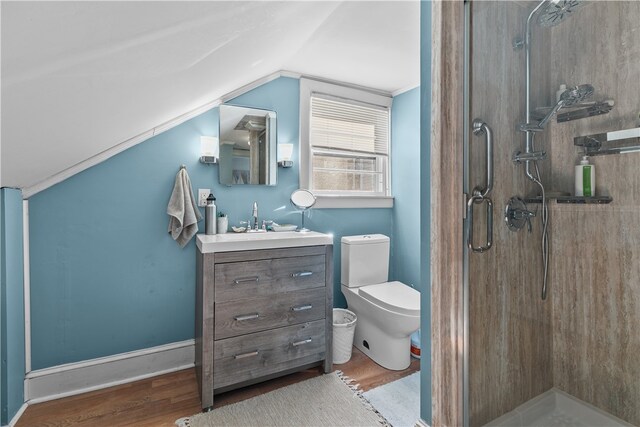 bathroom featuring hardwood / wood-style floors, vanity, walk in shower, and lofted ceiling