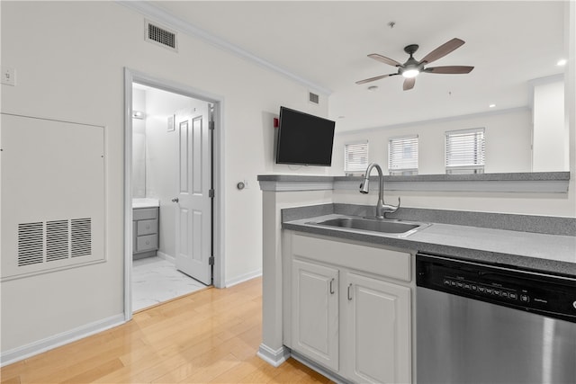 kitchen with sink, dishwasher, white cabinetry, ornamental molding, and light hardwood / wood-style floors