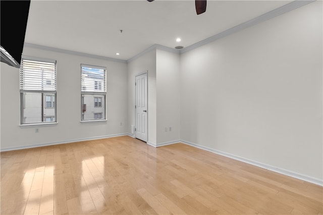 unfurnished room featuring crown molding, light hardwood / wood-style flooring, and ceiling fan