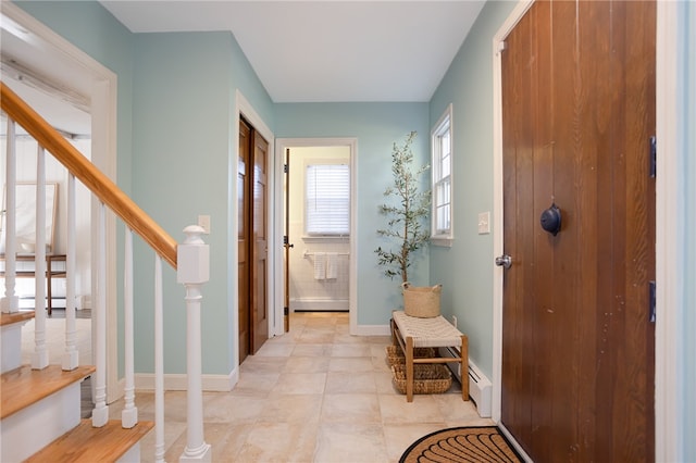 entryway with light tile patterned floors