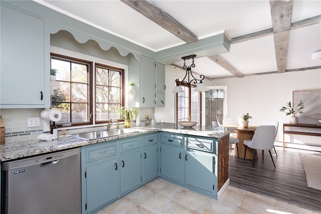 kitchen with dishwasher, tasteful backsplash, hanging light fixtures, and sink