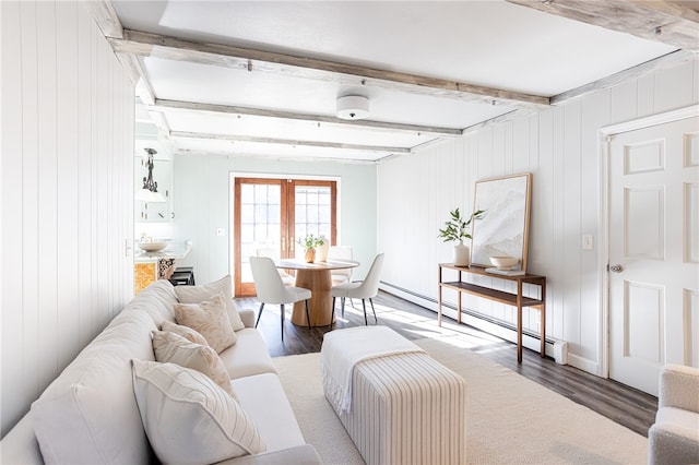 living room with french doors, a baseboard radiator, beamed ceiling, wooden walls, and hardwood / wood-style flooring