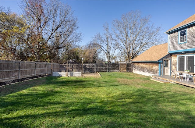 view of yard with a wooden deck