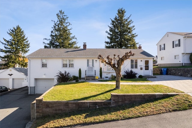 view of front facade with a front lawn and a garage