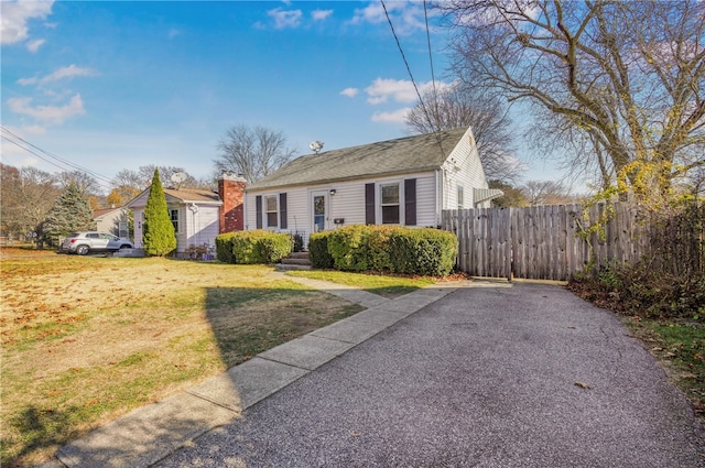 bungalow-style home featuring a front yard