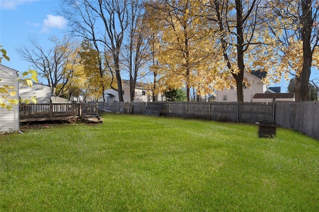 view of yard with a wooden deck