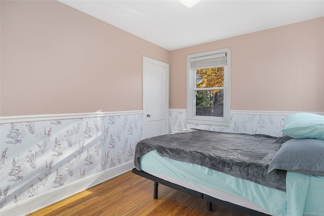 bedroom with wood-type flooring