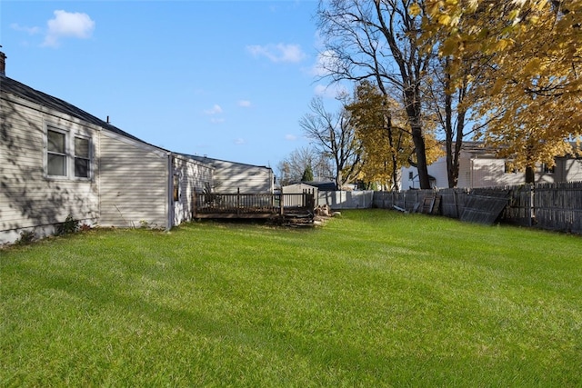 view of yard with a wooden deck