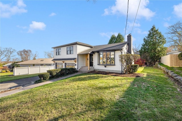 split level home with a front lawn