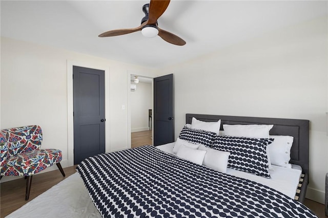 bedroom with hardwood / wood-style flooring and ceiling fan