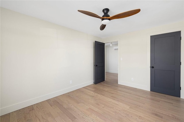 unfurnished bedroom featuring ceiling fan and light hardwood / wood-style flooring