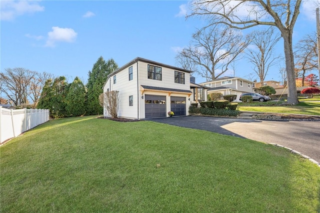 view of property exterior featuring a garage and a lawn