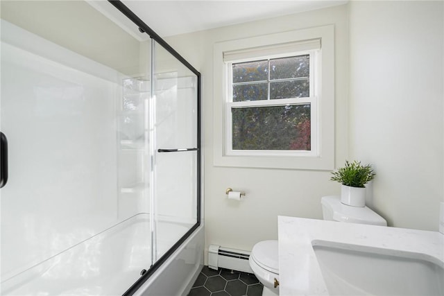 full bathroom with sink, combined bath / shower with glass door, tile patterned flooring, toilet, and a baseboard radiator