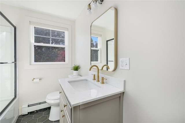 full bathroom featuring vanity, a baseboard heating unit, toilet, enclosed tub / shower combo, and tile patterned floors