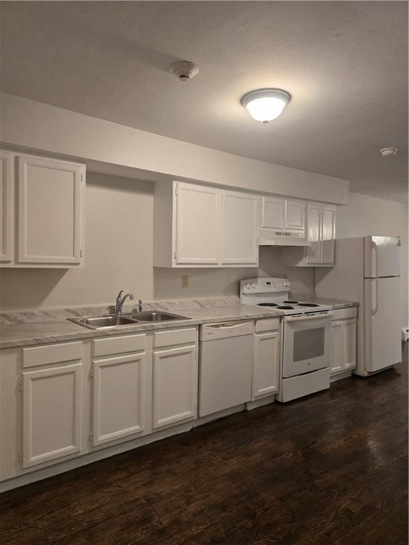 kitchen with dark hardwood / wood-style flooring, white appliances, white cabinetry, and sink