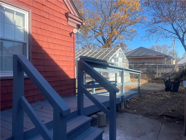 view of property exterior featuring a wooden deck