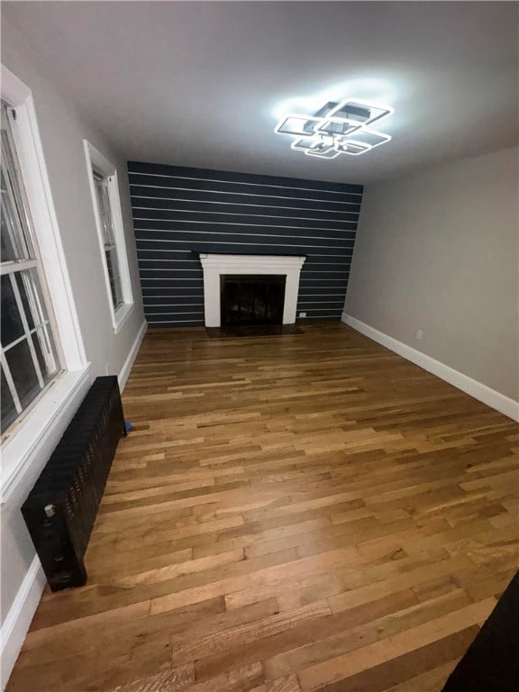 unfurnished living room with hardwood / wood-style floors